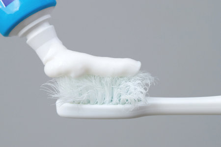 A damaged toothbrush is a breeding ground for germs and bacteria, which can cause swollen gums.の写真素材