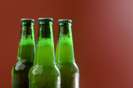 cold green beer bottle comes with a refreshing touch.の写真素材