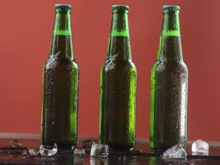 cold green beer bottle comes with a refreshing touch.の写真素材