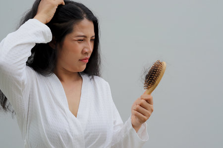 Woman with hair loss dryness and frizzinessの写真素材