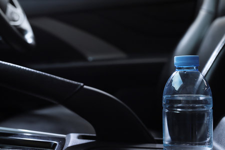bottle of water in the carの写真素材