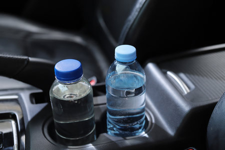 bottle of water in the carの写真素材