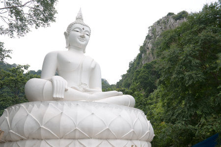 white statue buddha image on the mountain Thailandの写真素材