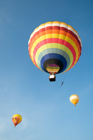 colorful hot balloon with blue skyの写真素材