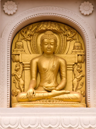 image of buddha sculpture on temple wall の写真素材