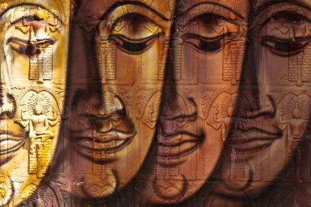 face of buddha image on temple wallのeditorial素材