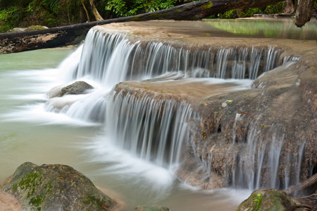 waterfall in tropical forest at Eravan national park Kanchanaburi province Thailandの写真素材