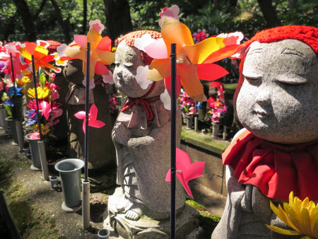 Stone statues of Jizo at the cemetery of Zojo-ji temple, Japanのeditorial素材