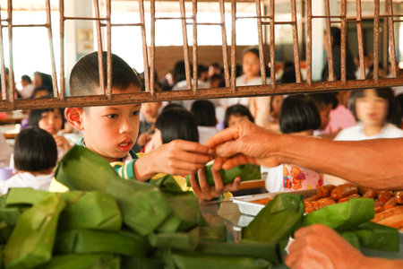 LOPBURI, THAILAND - FEBBRUARY 25, 2014 : Thai Students buy dessert at canteenのeditorial素材