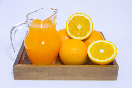 Orange juice and orange on white backgroundの写真素材