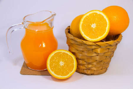 Orange juice and orange on white backgroundの写真素材