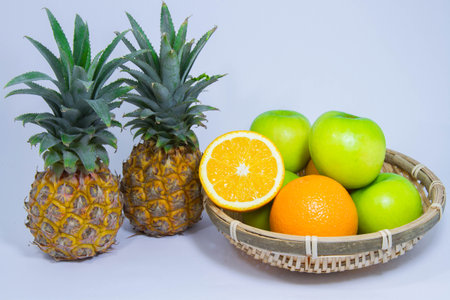 Orange pineapple apple fruit isolated on white backgroundの写真素材
