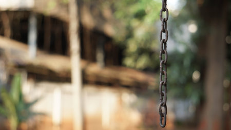 Rusty chain hanging in the air.