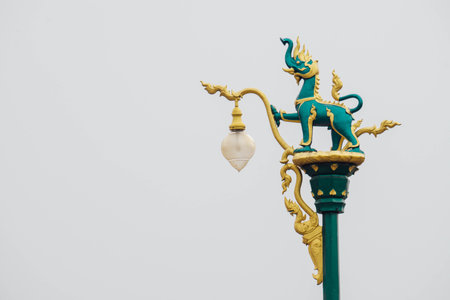 Steet lamp post with elephant or Lion on Himmapan Forest at above in Khon Kean,Thailand.の写真素材