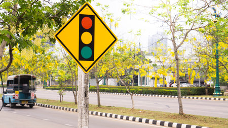 Traffic light sign,bus,Gloden shower tree.のeditorial素材