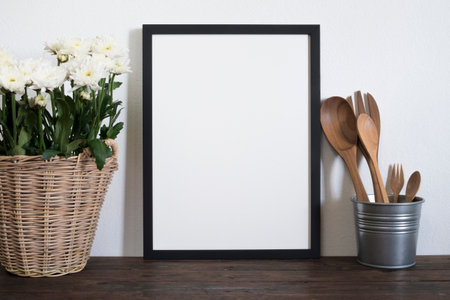 mock up frame poster with utensils on wooden tableの写真素材