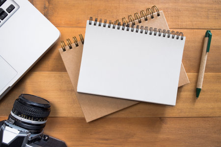 blank notepad with laptop,camera,pen.traveler checklistの写真素材