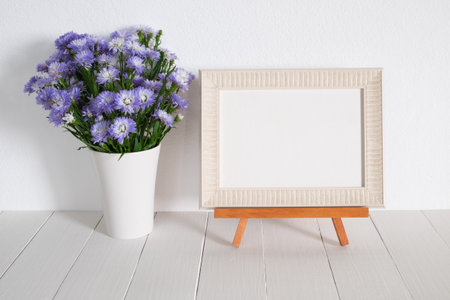 white frame with purple flower.home decorationの写真素材