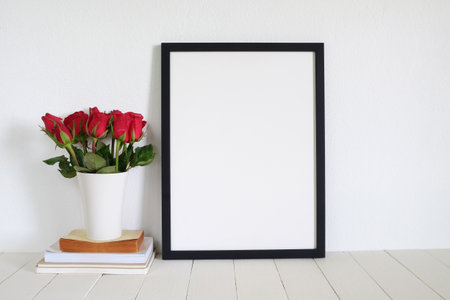 frame photo with red roses on table.home decorationの写真素材