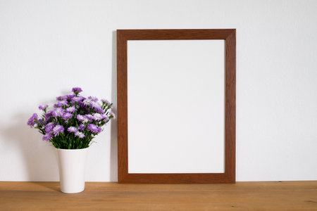 mock up wooden frame picture on tableの写真素材