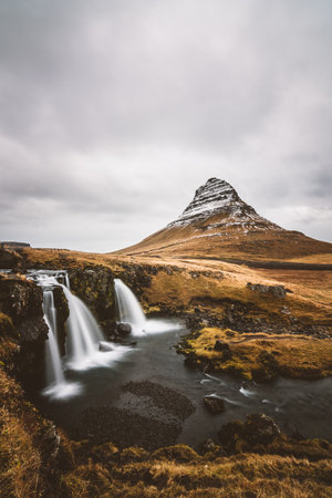 Kirkjufell mountain and waterfalls in SnÃ¦fellsnes, Iceland, captured in long exposure.