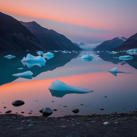 Dramatic sunset over glacial waters with icebergs and mountain reflectionsの素材