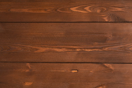Texture saw cut brown wood. Horizontal boards of aged pine. Embossed, rough matte finish. Photo background.の写真素材