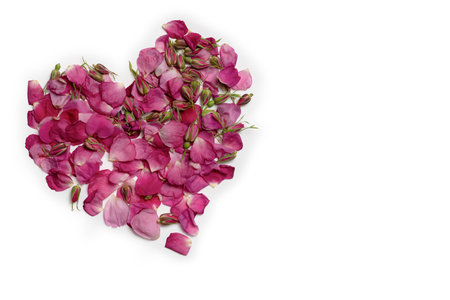 Isolate. The heart is made of petal rose. White background. For greetings, weddings, postcard, valentine. Free space for text.の写真素材