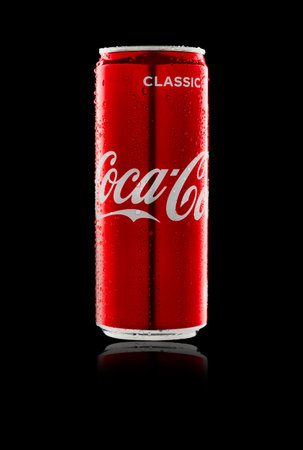 Russia, Republic of Bashkortostan, Mrakovo, - May 07, 2020: Coca-Cola aluminum can. Black background. Drops of dew on the walls. Side view. Partly blurred. Close-up.のeditorial素材