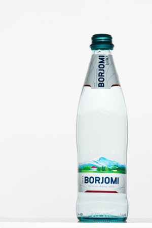 Russia, Republic of Bashkortostan, Mrakovo, - May 8, 2020: Glass bottle of Georgian mineral water Borjomi. White background. Close-up. Health care. Natural drink.のeditorial素材