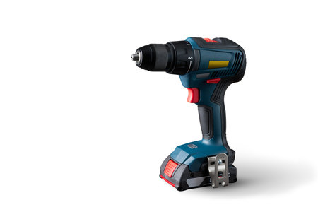 Professional cordless drill close-up on a white background. Isolated. Free space for the text. For advertisements, catalogs, and the Internet.の写真素材