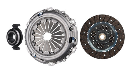 Car clutch set isolated on white background. Clutch disc and basket with release bearing.の写真素材
