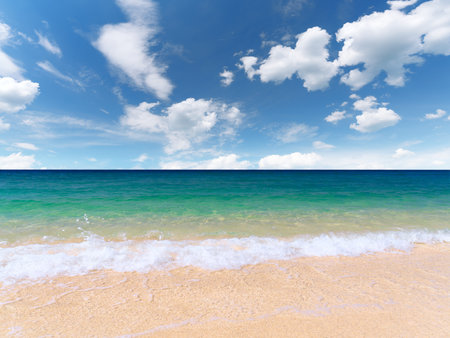 Beautiful seashore with clean yellow sand. Calm water surface. Sunny day with rare clouds. Theme for recreation, tourism, nature, advertising.の写真素材