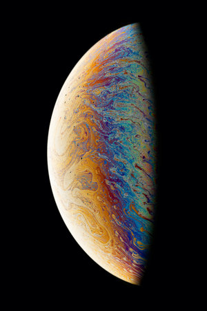 A black background with half of a bubble. Bright, colorful fantastic patterns.の写真素材