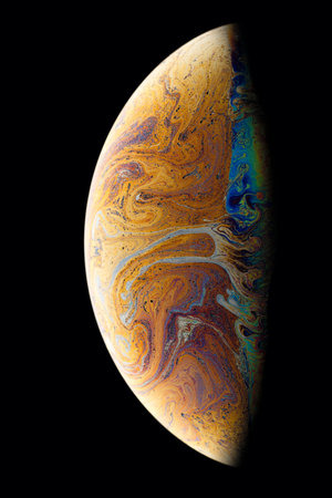 A black background with half of a bubble. Bright, colorful fantastic patterns.の写真素材