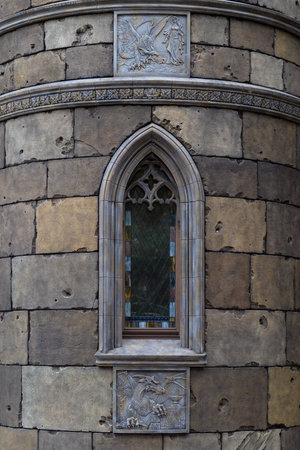 Russia, Samara Oblast, Khryashchevka village - July 31, 2023. Close-up of stained glass and a bas-relief on a tower of Garibaldi Castle. Architecture and landmarks.のeditorial素材