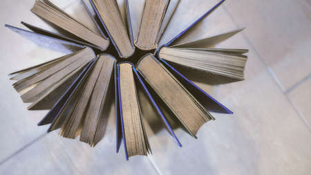 a few very old and worn books together seen from above