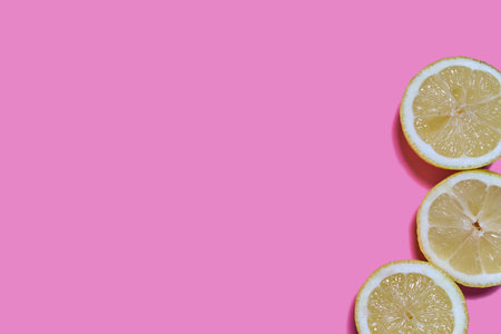 Lemon slices on a pink background. CITRUS CITRICの写真素材
