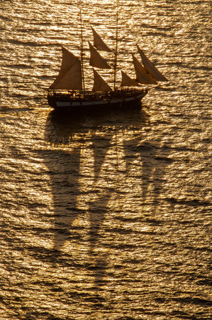 Ship on the coast of Santorini, photograph taken from the cliffs of Oiaの写真素材