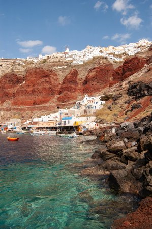 view of the old fishing port with ships and fisherman houses of oia, santoriniの写真素材
