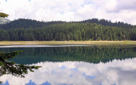 Crno Jezero (Black Lake), Durmitor National Park, Montenegro. Reflection of clouds in the waterの写真素材