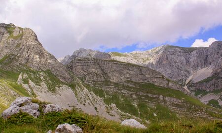 Durmitor Ring road panorama in Montenegro national park. Scenic landscape of high mountains, green...