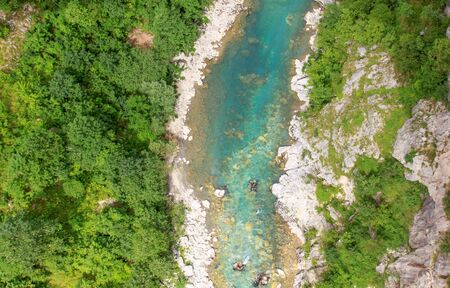Drone view of turquoise clean water of Tara river and lush green forest on banks, in Montenegroの写真素材