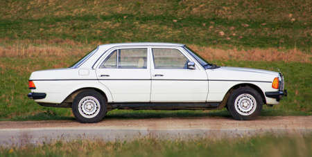 CLUJ-NAPOCA, ROMANIA - August 5, 2011: Illustrative editorial - Classic Mercedes-Benz W 123 white...