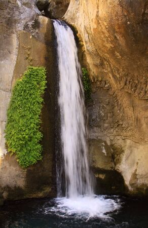 Vertical waterfall with green plants on the side, in Turkeyの写真素材