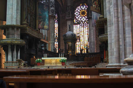 MILAN, ITALY - May 26, 2013: illustrative editorial - Altar and stained glass windows inside Duomo...