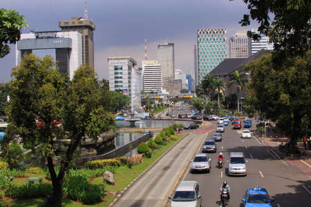 JAKARTA, INDONESIA - May 30, 2013: Jalan Medan Merdeka, in the center Jakarta city center on a sunny day. In the Middle of financial district, close to Monas Tower or Monumen Nasional, Indonesiaのeditorial素材