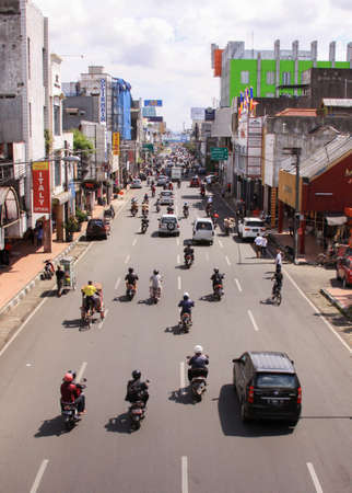 Bandung center busy traffic street, Java island, close to Jakarta, Indonesia busy street in daylight, seen from a bridgeのeditorial素材