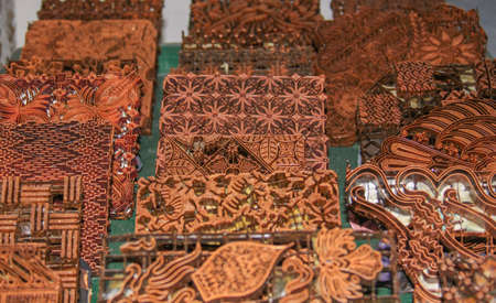 Wax copper stamps at Batik Winotosastro factory in Yogyakarta, Java, Indonesia. Batik motif sample...
