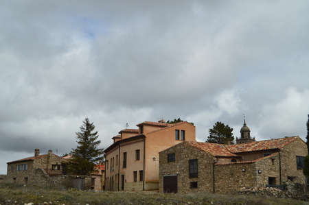 Stone Houses On The Top You Can See The Bell Tower Of The Cathedral In The Village Of Medinaceli. Architecture, History, Travel. Medinaceli, Soria, Castilla Leon, Spain.の写真素材
